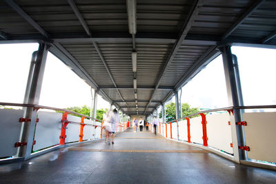 People walking on bridge