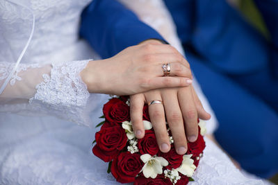 Close-up of couple holding hands