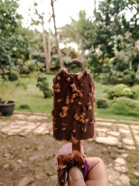 Midsection of person holding ice cream