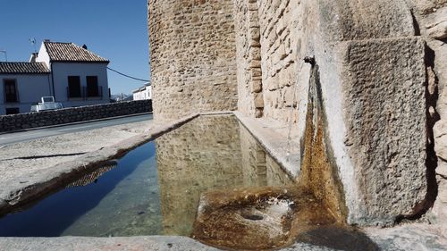 Reflection of old building in water