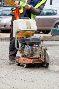 Man working on street in city