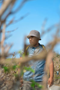 Full length of young man looking away