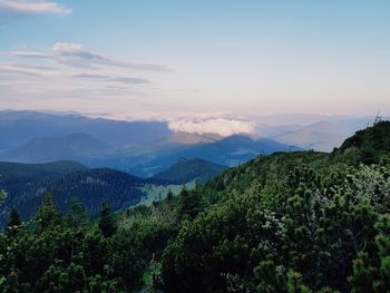 Scenic view of mountains against sky at sunset