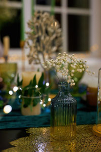 Romantic dinner table setting with festive lights