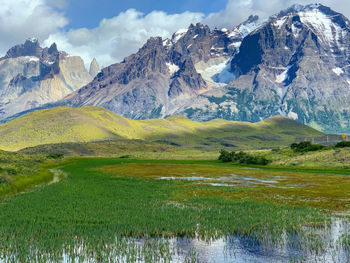 Scenic view of lake and mountains against sky at torres del paine 