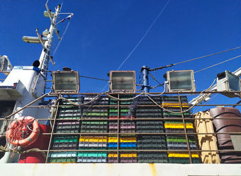 Low angle view of office building against clear blue sky