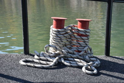 Close-up of rope tied to bollard