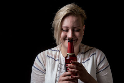 Close-up of a mid adult man against black background