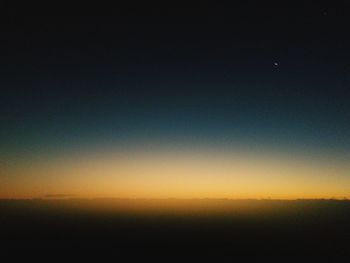 Scenic view of sea against clear sky during sunset