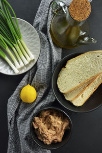 Raw taramas, olive oil , lemon, fresh onions, bread ,ingredients for making taramosalata dip