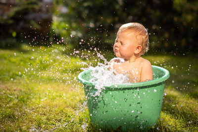 Boy looking away in water