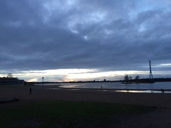 Scenic view of beach against sky during sunset