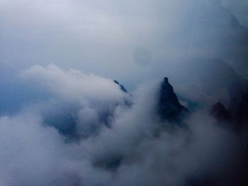 Scenic view of tianmen mountains covered with clouds