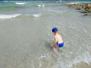 High angle view of boy at beach