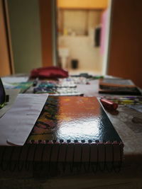 Close-up of open book on table at home