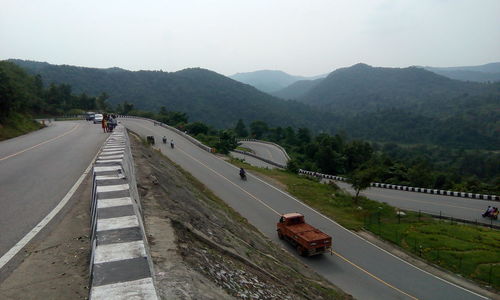 High angle view of cars on road against sky
