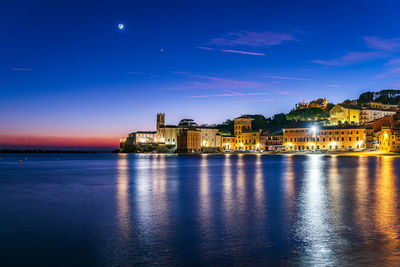 Illuminated buildings in city at night