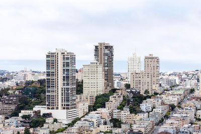 Buildings in city against sky