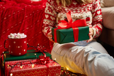 Midsection of woman using mobile phone