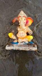 Close-up of statue against temple