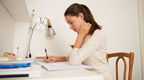 Young woman using laptop at home