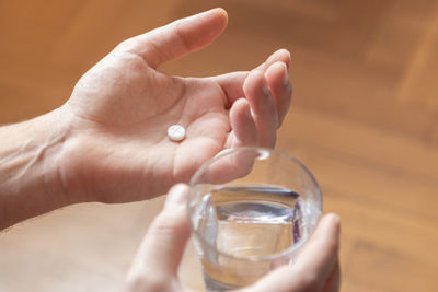 Cropped hand of person holding glass