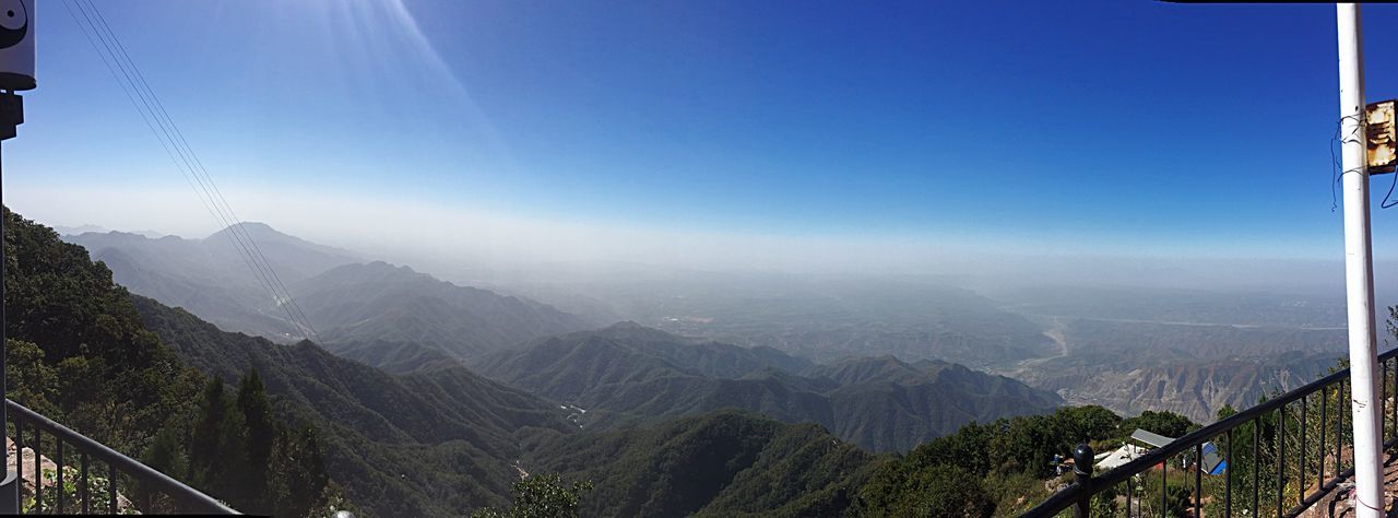 mountain, scenics, mountain range, beauty in nature, clear sky, tranquil scene, tranquility, landscape, nature, blue, copy space, sky, idyllic, aerial view, panoramic, day, non-urban scene, built structure, sunlight