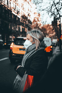 Man standing on city street