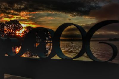 Close-up of silhouette water against sky during sunset