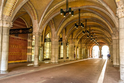 Rear view of person in illuminated building