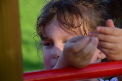 Close-up of cute girl playing on playground