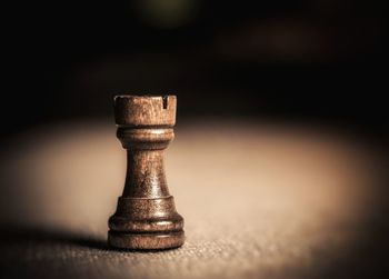 Close-up of chess piece on table