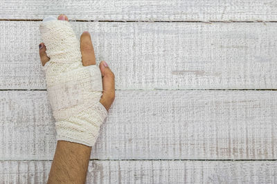 Close-up of hand on wall