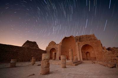Old building against sky at night