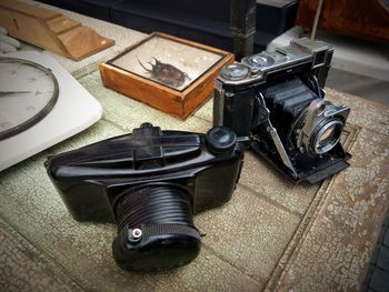 High angle view of old camera on table