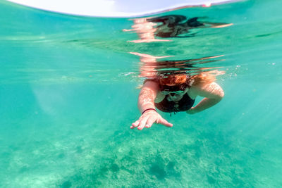 Girl swimming in sea