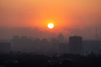 High angle view of city at sunset