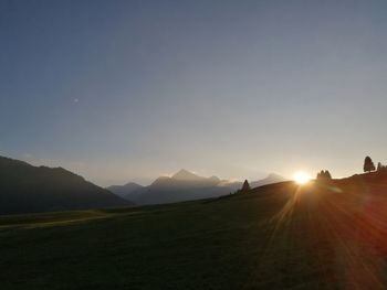 Scenic view of landscape against sky during sunset