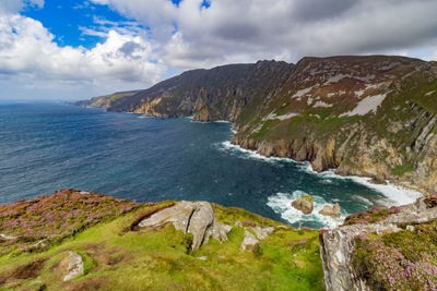 Scenic view of sea against cloudy sky