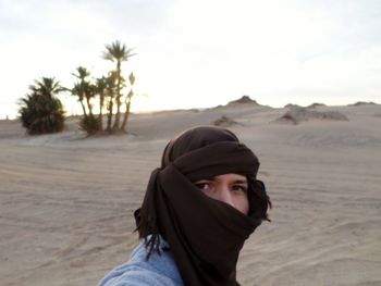 Portrait of woman standing on mountain