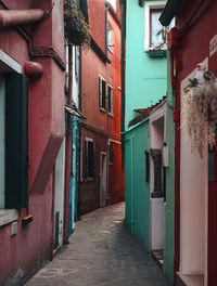 Narrow alley amidst buildings in town