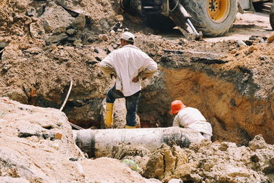 Manual workers working at construction site