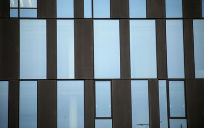 Full frame shot of building against blue sky