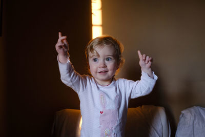 Close-up of cute baby girl at home