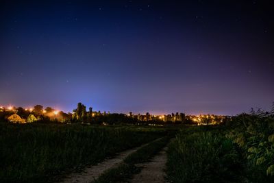 Scenic view of field against sky at night