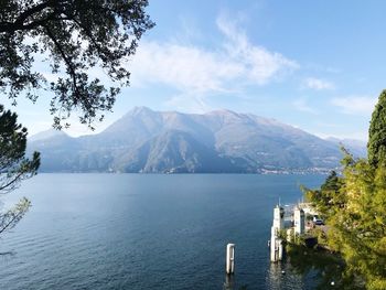 Scenic view of sea and mountains against sky