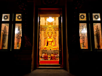 View of buddha statue in illuminated building