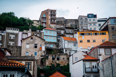 Buildings in town against sky