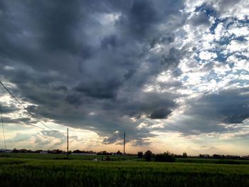 Scenic view of field against sky during sunset