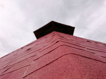 Low angle view of roof against sky
